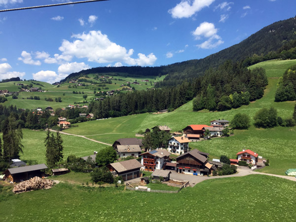 View of the green landscape from the Alpe di Siusi Cableway