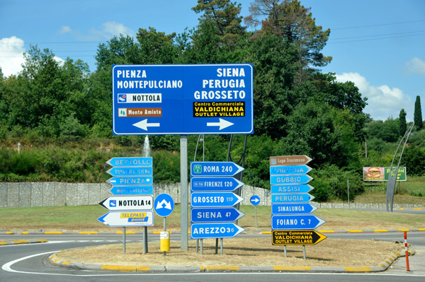 Road signs in Tuscany - Montepulciano, Pienza, Siena
