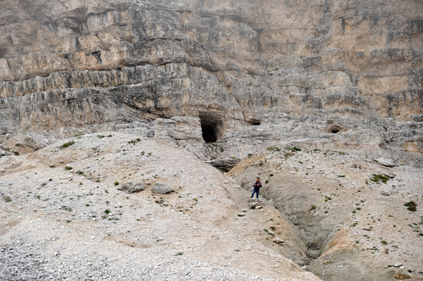 Max hiking up to one of the tunnel entrances at the base of the Tre Cime