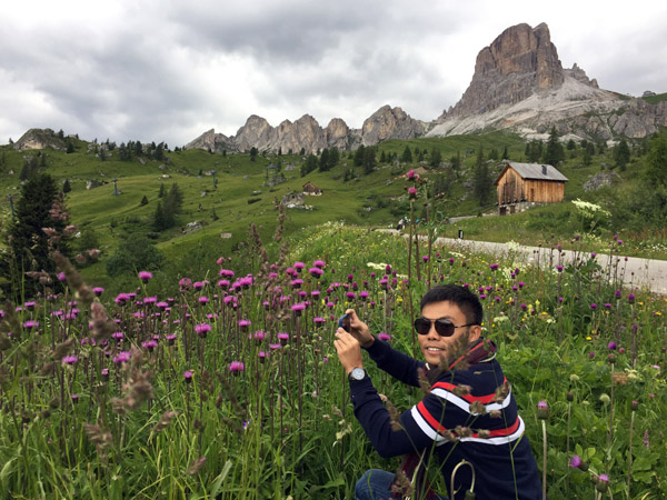 Max and wildflowers on the west side go Giau Pass