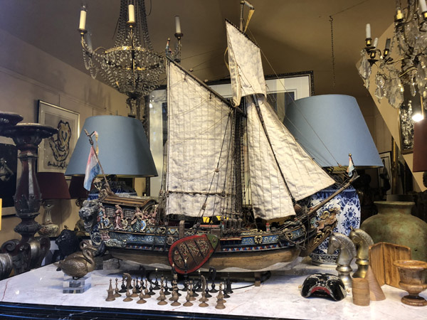 Antique shop with a model of an old Dutch merchant ship, Amsterdam