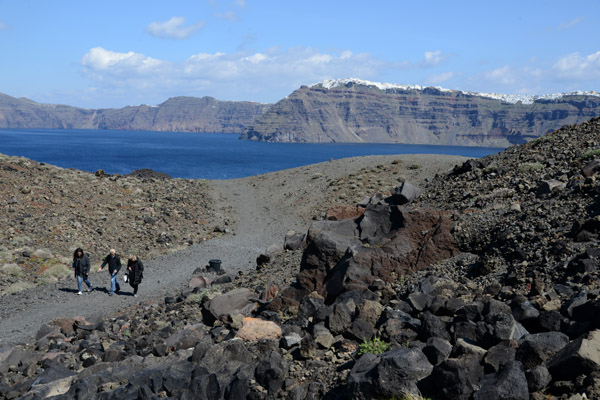 Tourists climbing to the crater of Tholos Naftilos, Nea Kameni