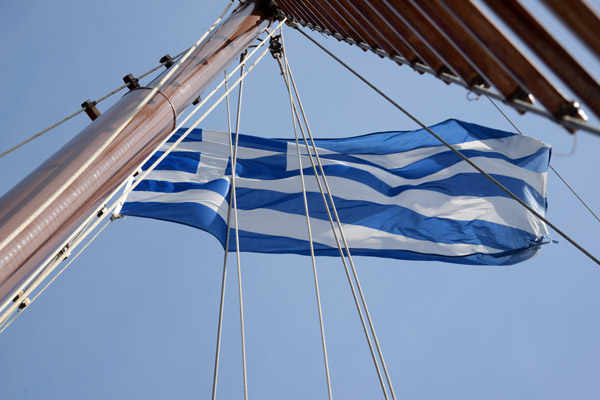 Greek flag on the mast of our tour boat, Santorini