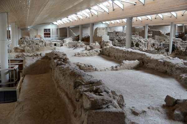 A modern roof protects the excavated ruins of Prehistoric Akrotiri