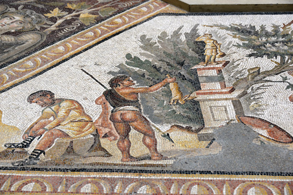 Ancient mosaic of a hunter offering a rabbit