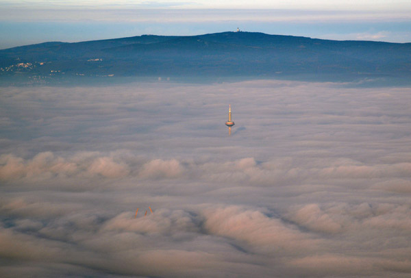 Frankfurt's TV Tower rising through the low cloud
