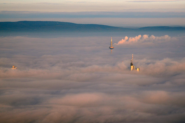Towers of Frankfurt rising above the low clouds