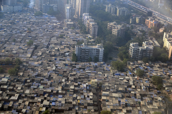 High-rise Flight View Co-op Housing Society rising out of the shanties surrounding Mumbai Airport