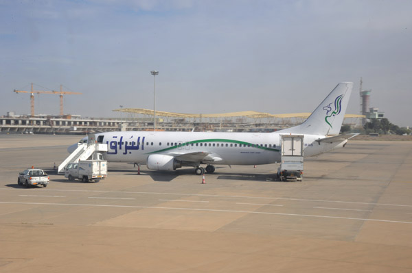 Al Burak B737-400 (5A-MAB) with the construction of the new terminal at Tripoli Airport, Libya