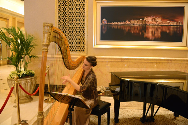 Harpist playing in the lobby of the Emirates Palace Hotel