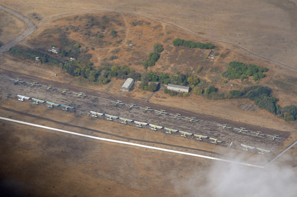 Small aerodrome near Tashkent with around 30 Antonov An-2 biplanes, Uzbekistan