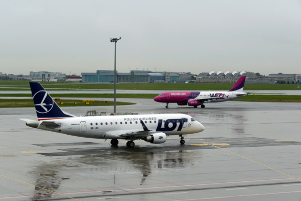 LOT Polish Embraer 170 (SP-LDI) at Warsaw with a Wizzair A320