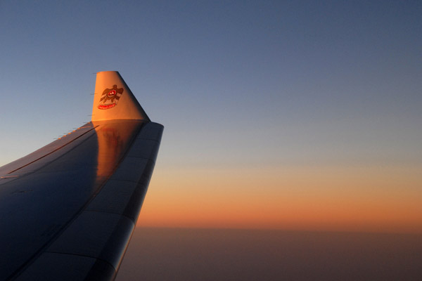 Winglet of an Etihad A330 in flight at sunset