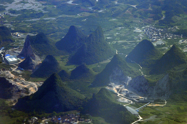 Quarrying a limestone karst mountain near Guilin, Guangxi Province, China