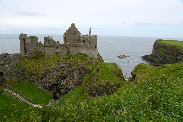 Blending with the sea cliffs, the ruins of Dunlace Castle