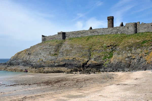 Peel Castle is on an island at high tide connected to the mainland by a causeway