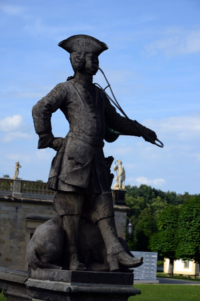 Statue in 18th C. dress at the base of the ramp, Moritzburg Castle