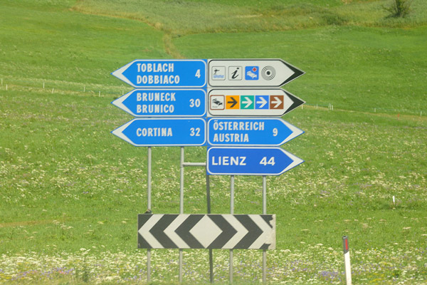 Roadsigns from the train 4 km into Italy from Lienz to Bruneck