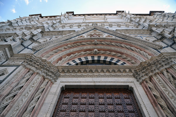 The Baptistry of St. John, located beneath Siena Cathedral, is accessed through a separate entrance on the opposite end 