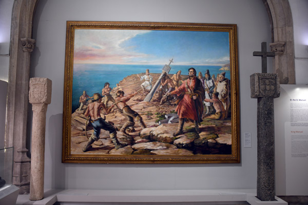 Portuguese explorers raising a stone marker on the coast of Africa