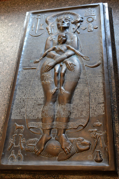 Bronze relief of a woman in child in the room with Petras Repys frescos