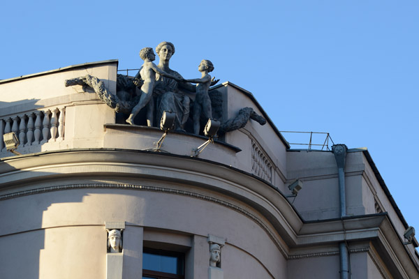 Architectural detail with a sculpture of a woman and two children, Minsk
