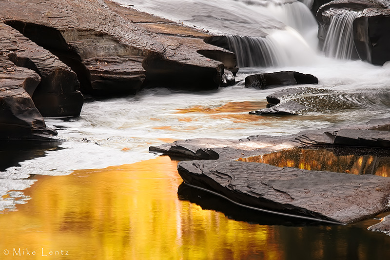 Presque Isle River golden flowing reflection