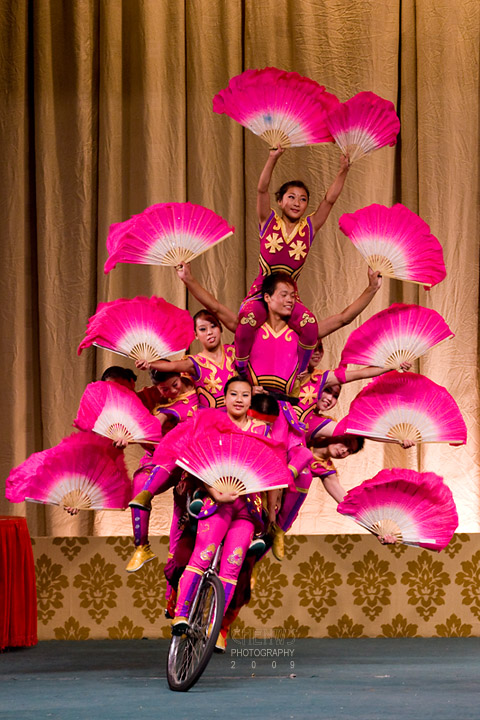 Fan dance together on a bike