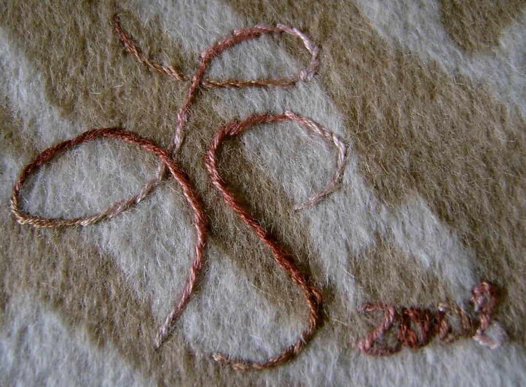 Monogram on Cashmere to be appliqued to the lining.