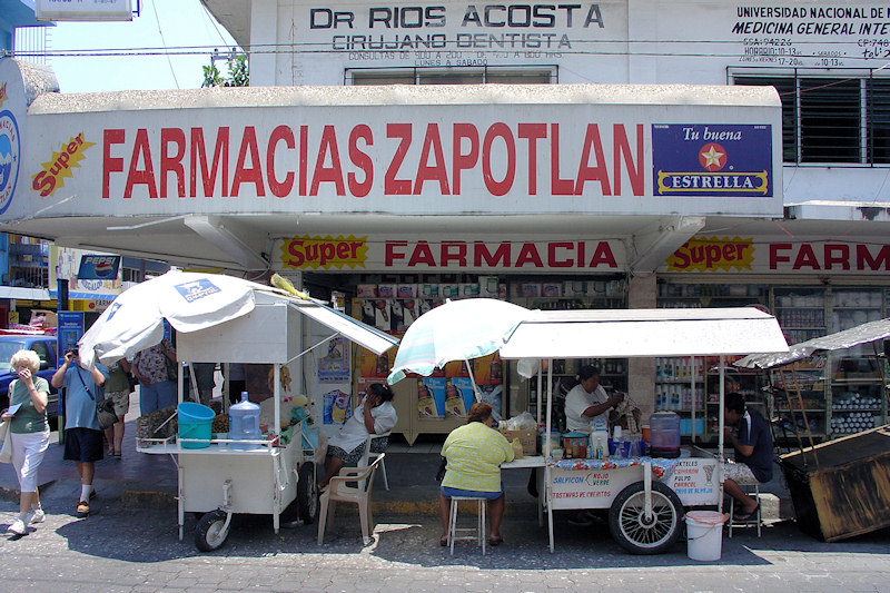 DSC01667 - Street vendors outside a pharmacy and medical clinic