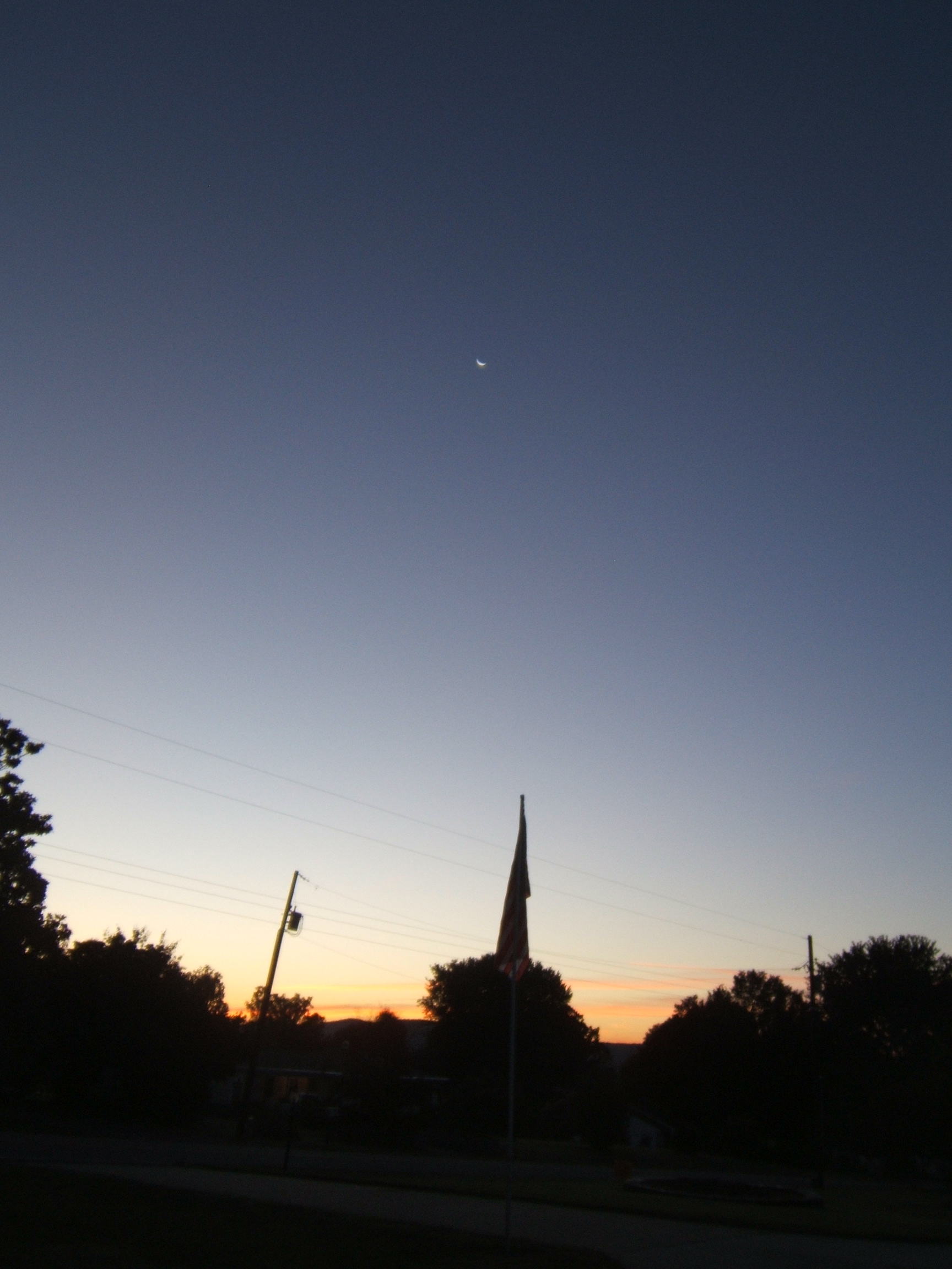 Sun and Moon sharing the early skies