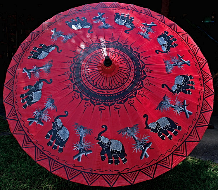 Large umbrella with elephants and bamboo