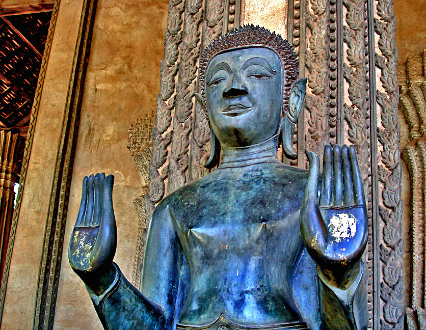 One of a pair of standing Buddhas at the front of the temple