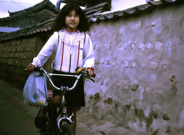 village girl on bike.jpg