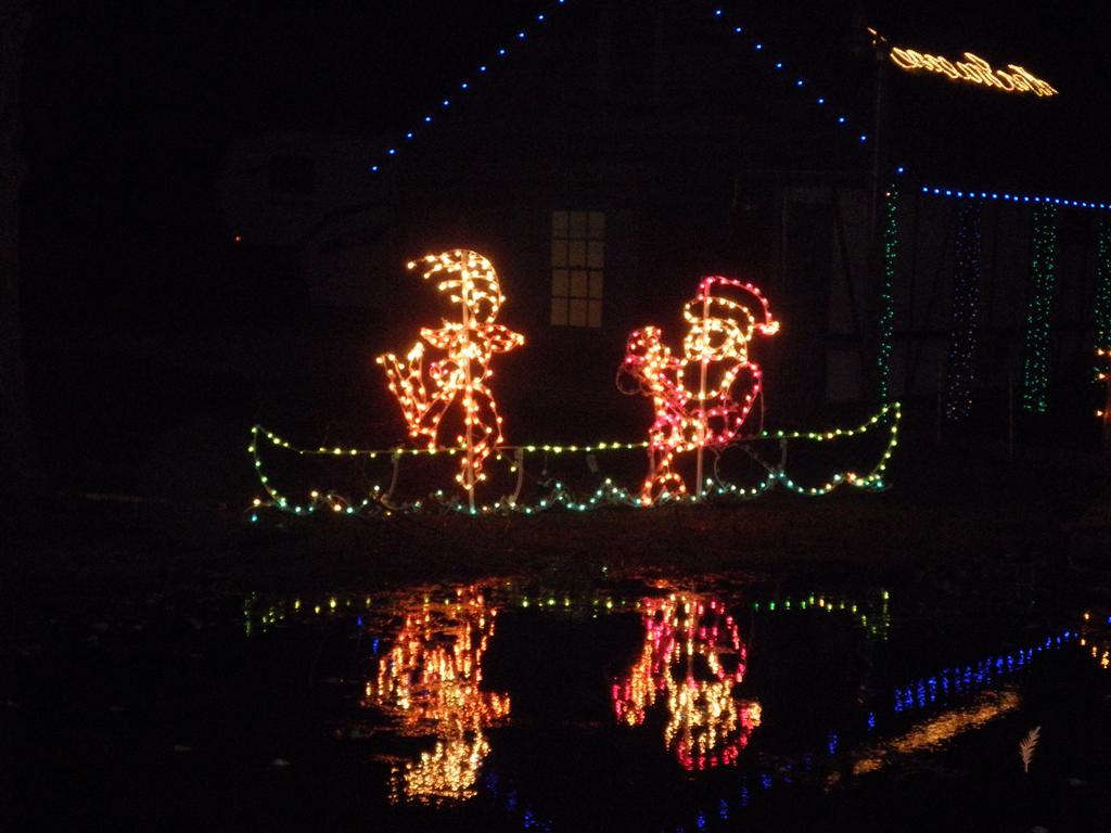 Santa & Elf  padding toward the Cajun homes