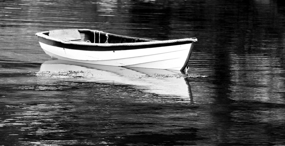 Dory moored in running tide