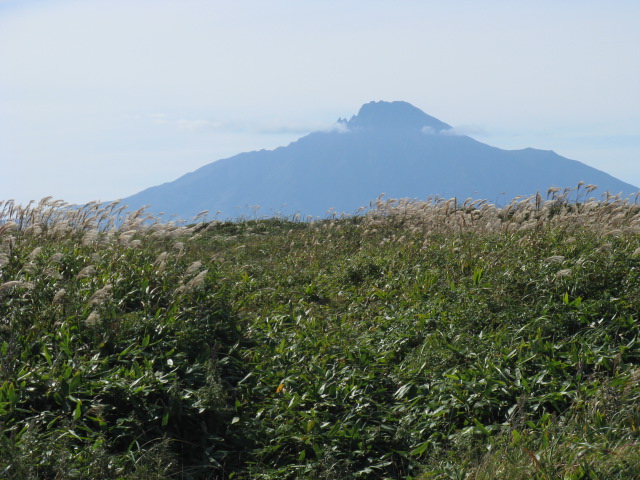 Theres a headwind most of today. Mt. Rishirifuji still looms offshore as we ride south down the west coast of Hokkaido.