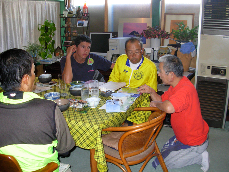 The owner gives us advice on climbing Rishirifuji.