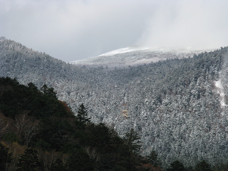 The surrounding mountains are a magnificent sight.