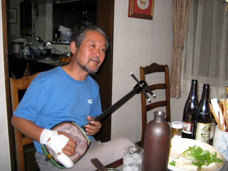 Shige plays the shamisen, a traditional Japanese 3-string lute.