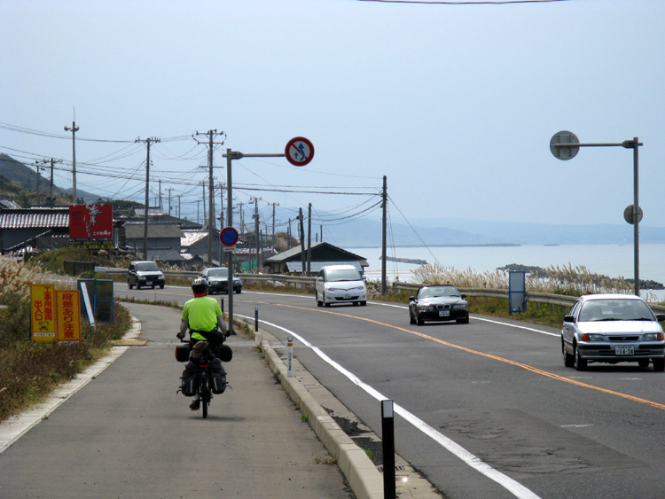 Jay riding into a coastal city