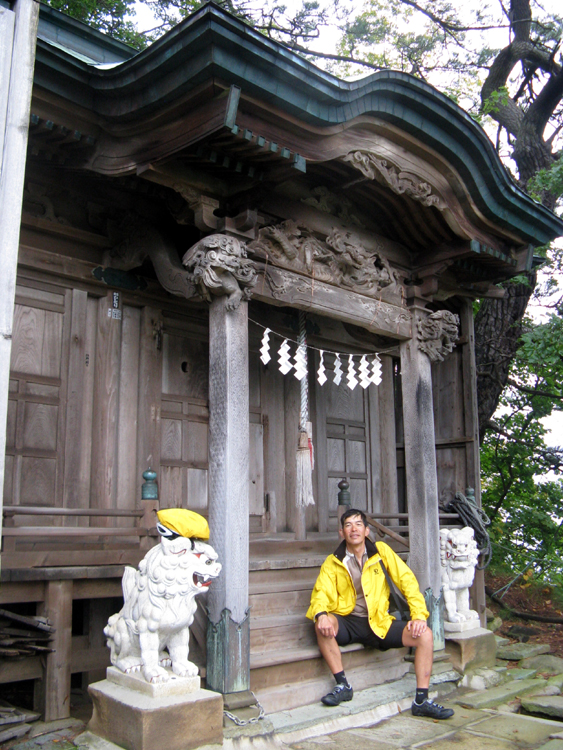 At the top in front of the shrine.