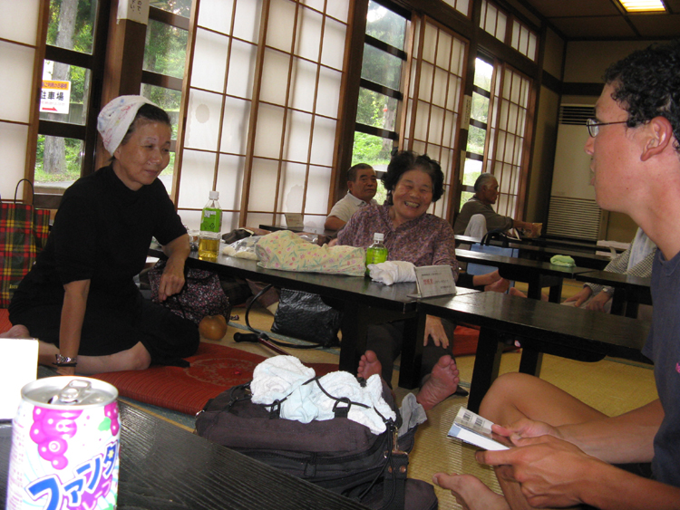 Resting in the tatami room after a hot bath. These friendly ladies offered us some fruit and snacks.