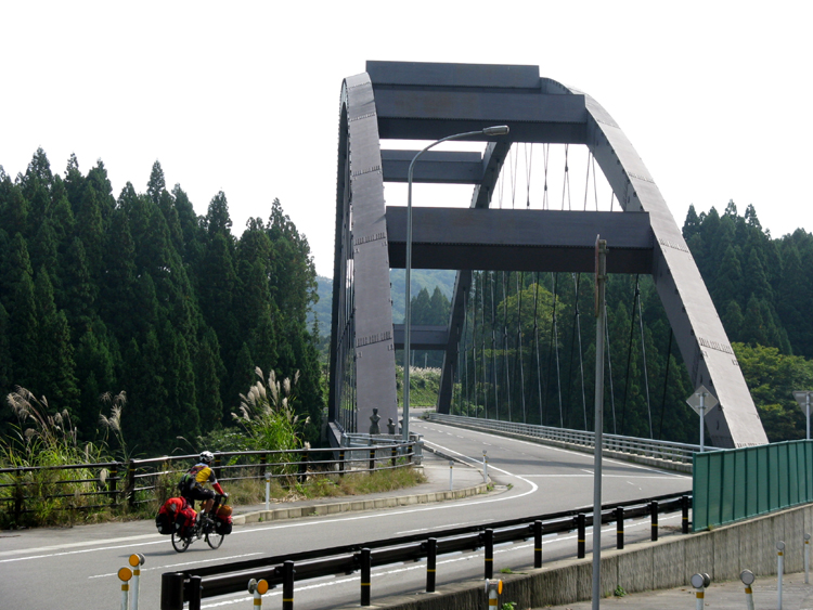 Notices the art work on the left before the bridge.