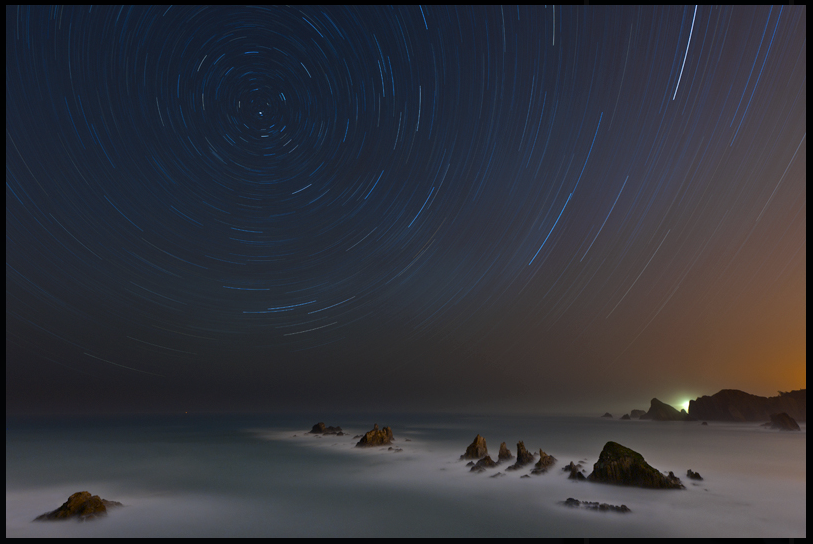 Star trails over coast of spain