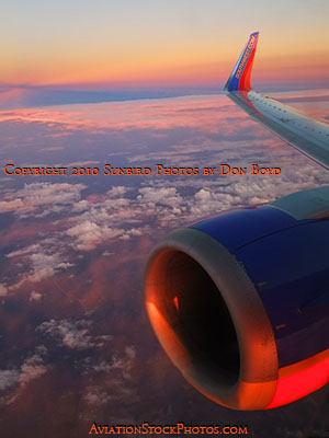 Onboard Southwest flight #2380 with nice sunset colors outside - aviation sunset stock photo #3789