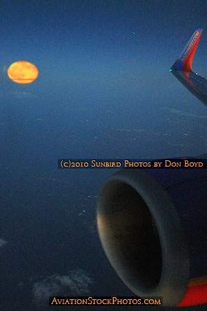 Harvest Moon rising as viewed from Southwest flight #2380 from FLL to BNA aviation stock photo #3817 (Composite photo)