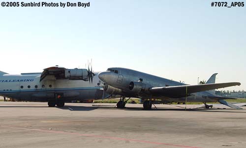 Avialeasing An-12BP UK-11418 next to damaged right wing of Florida Air Cargos DC3-S1C3G N123DZ aviation stock photo #7072