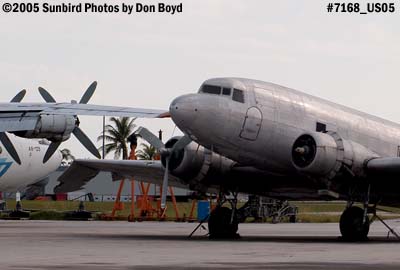 Florida Air Cargo's DC3-S1C3G N123DZ and damaged right wing next to Avialeasing An-12BP UK-11418 aviation stock photo #7168