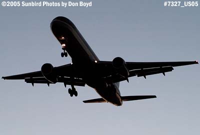 U S Airways B757 landing at dusk aviation stock photo #7327